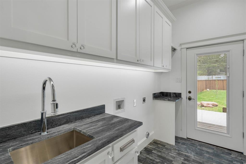 5727 Victor Street Dallas, TX 75214 - Photo 22 of 40 a kitchen with a sink and cabinets