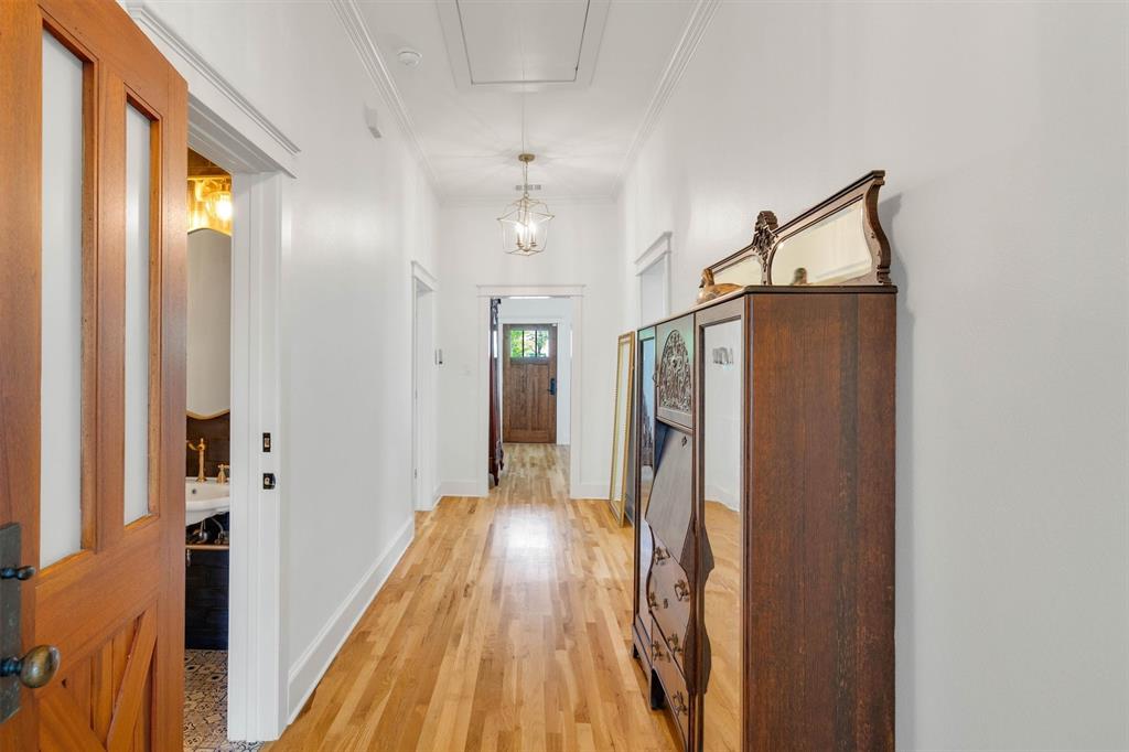 5727 Victor Street Dallas, TX 75214 - Photo 24 of 40 a view of hallway with wooden floor and stairs