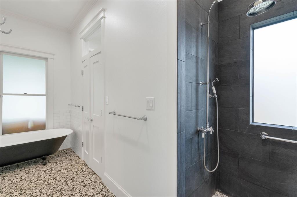 5727 Victor Street Dallas, TX 75214 - Photo 33 of 40 a bathroom with a bathtub and shower