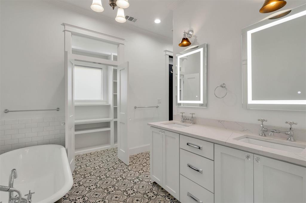 5727 Victor Street Dallas, TX 75214 - Photo 35 of 40 a bathroom with a sink a toilet and shower