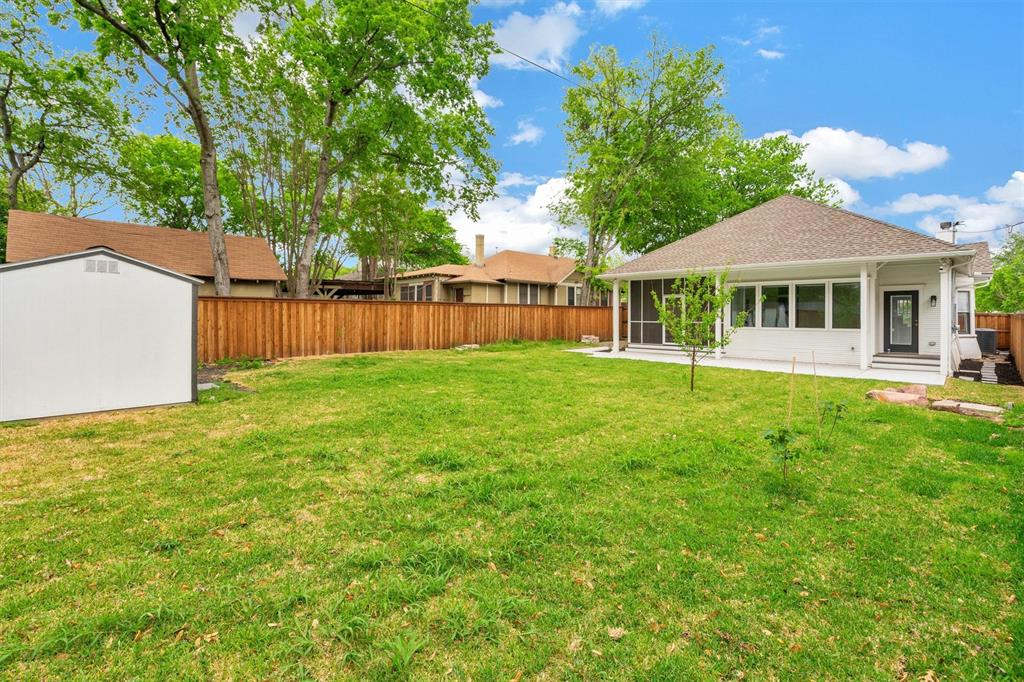 5727 Victor Street Dallas, TX 75214 - Photo 39 of 40 a front view of a house with a yard and trees