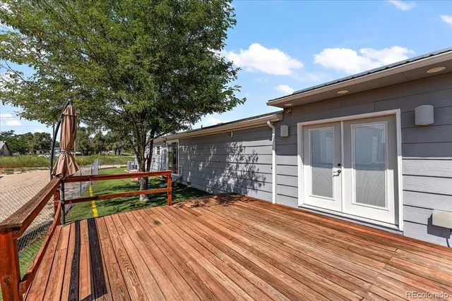 a view of outdoor space with deck and large tree