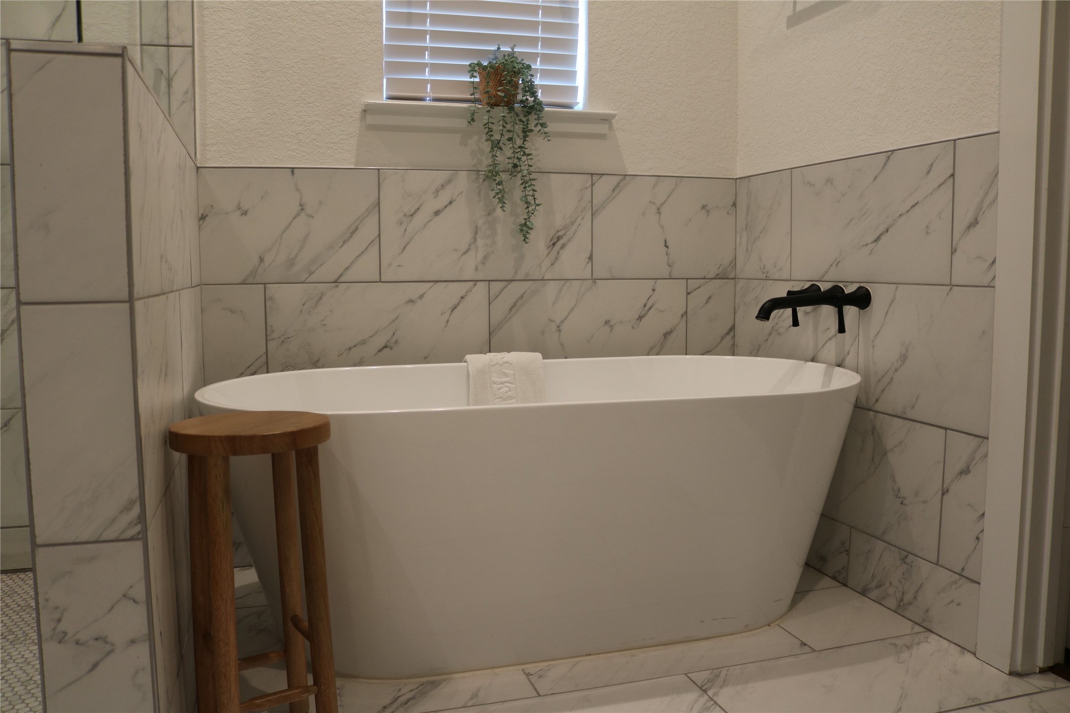 4714 Fisk Street Houston, TX 77009 - Photo 17 of 20 a white bath tub sitting in a bathroom