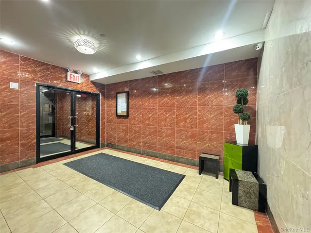 a bedroom with a bed and a mirror