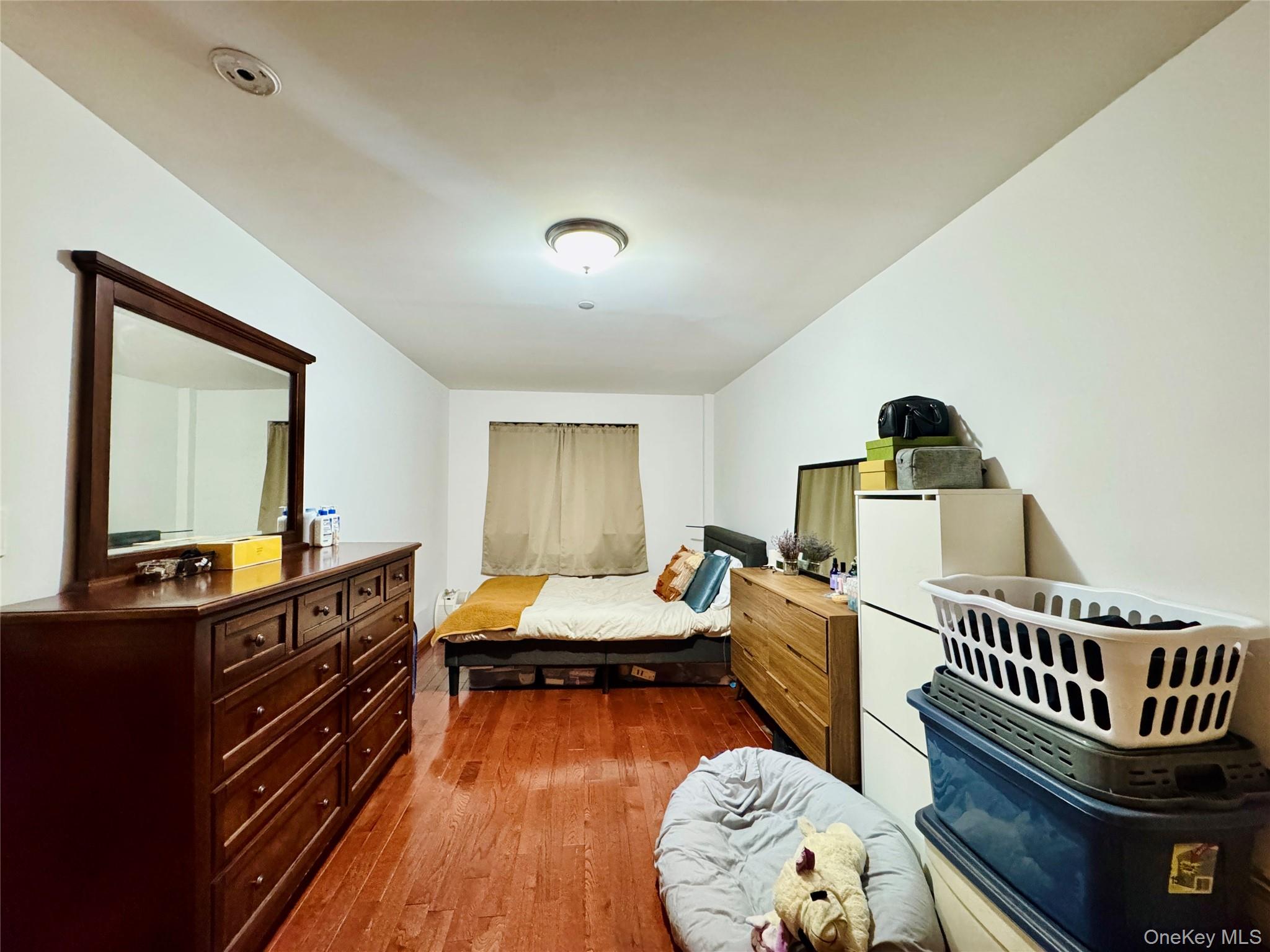 37-49 81st Street, Unit 3A Queens, NY 11372 - Photo 9 of 20 a bedroom with furniture and a window