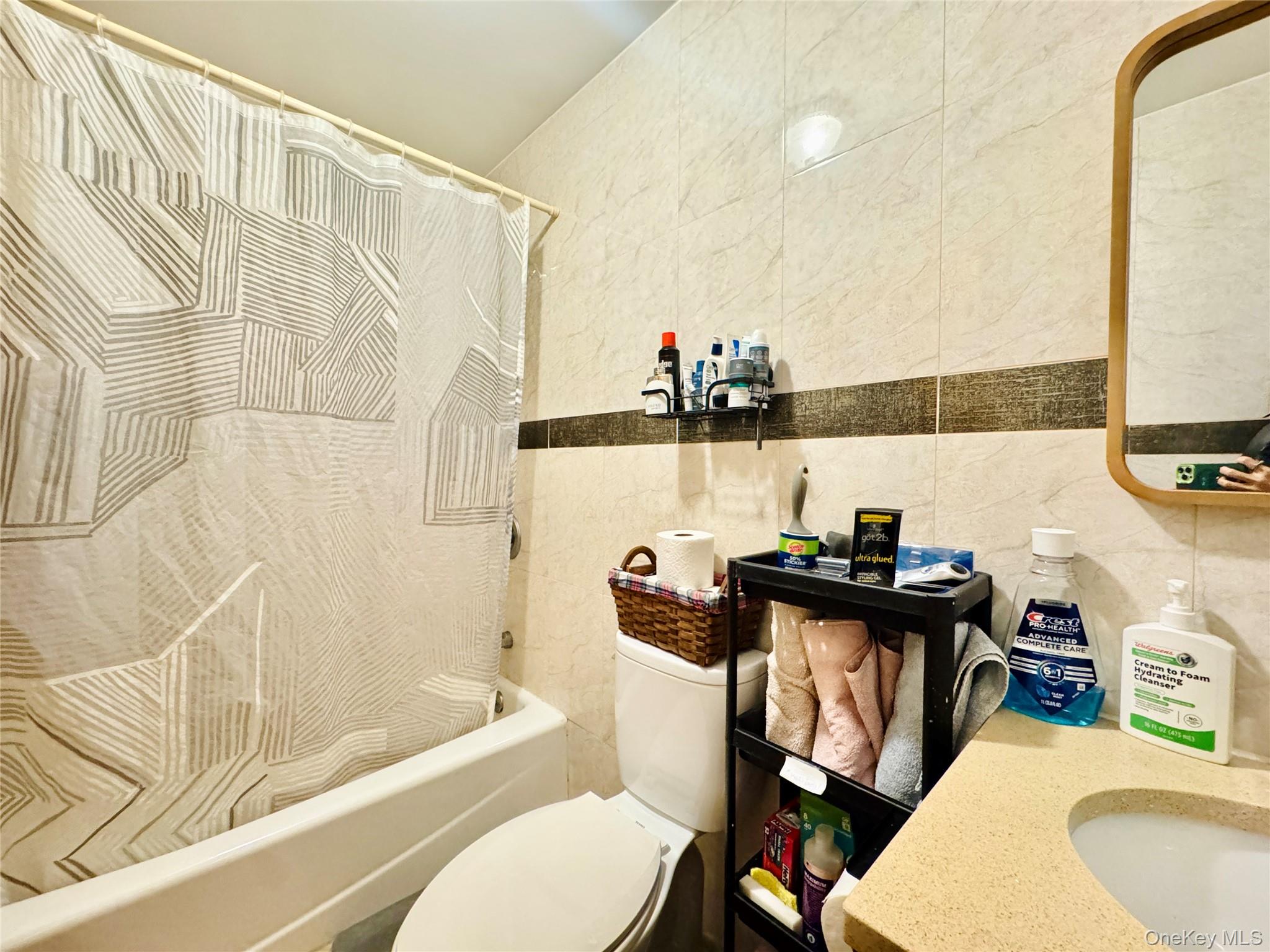 37-49 81st Street, Unit 3A Queens, NY 11372 - Photo 10 of 20 a bathroom with a sink a toilet and bathtub