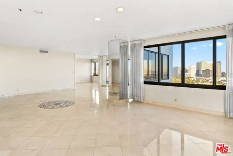a spacious bathroom with a granite countertop tub sink and mirror