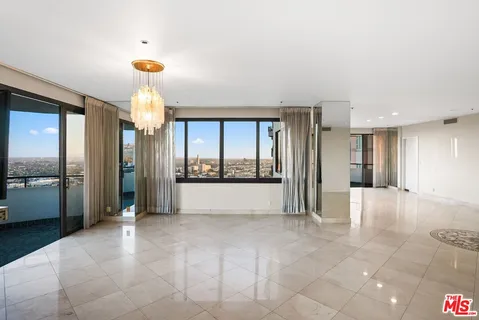 a en suite bathroom with a granite countertop sink and a mirror