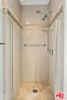 a view of a patio with plants and table and chairs with potted plants