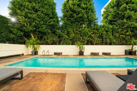 a very nice looking dining room with kitchen island furniture and a chandelier