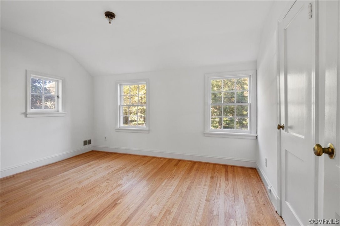4124 Hillcrest Road Richmond, VA 23225 - Photo 25 of 34 an empty room with wooden floor and windows