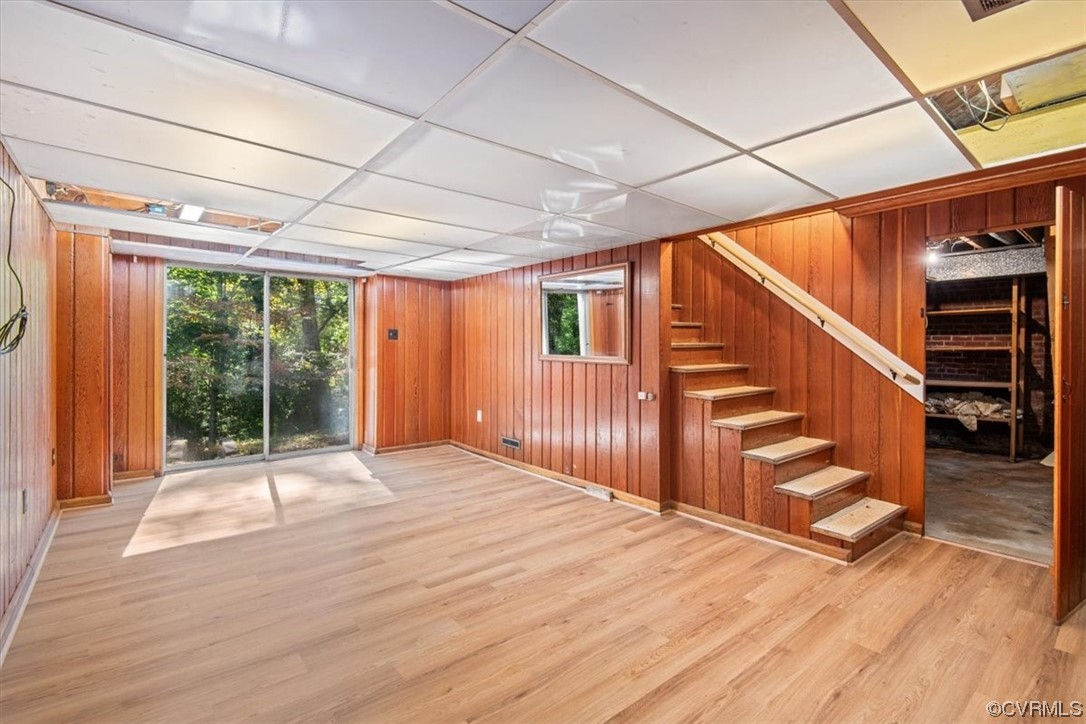 4124 Hillcrest Road Richmond, VA 23225 - Photo 30 of 34 a view of an empty room with wooden floor and stairs