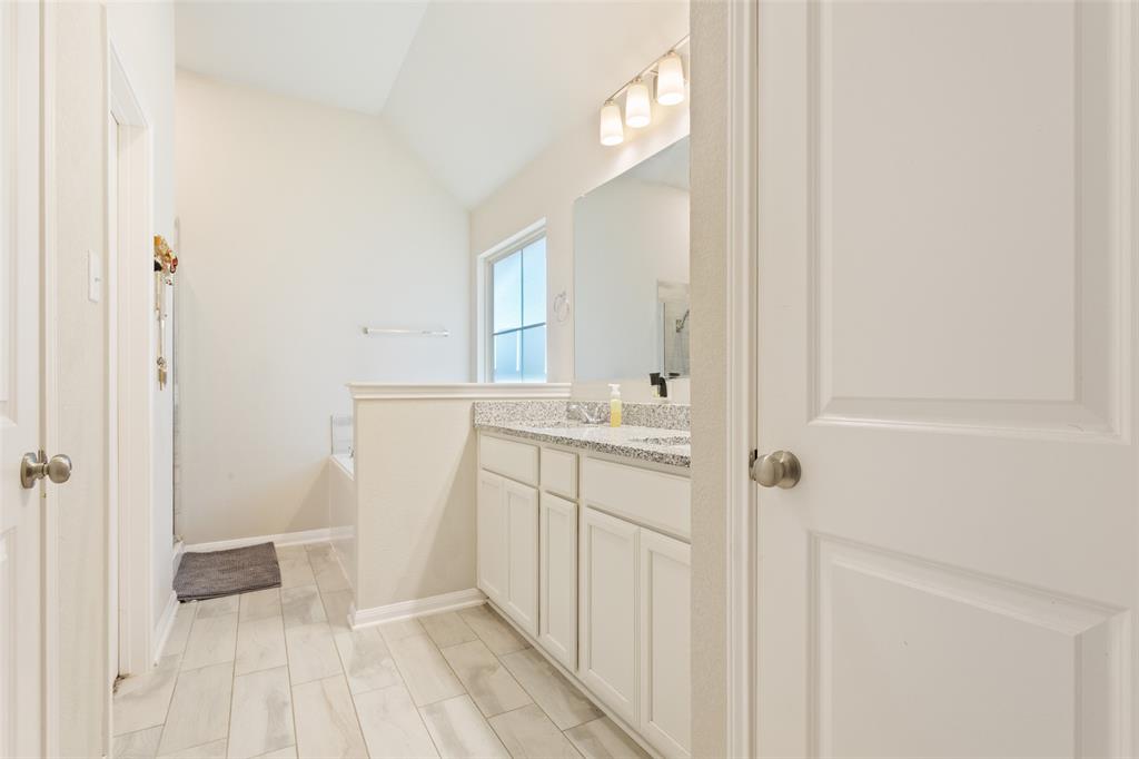10204 Driskill Drive Waco, TX 76708 - Photo 19 of 30 a bathroom with a sink and a mirror