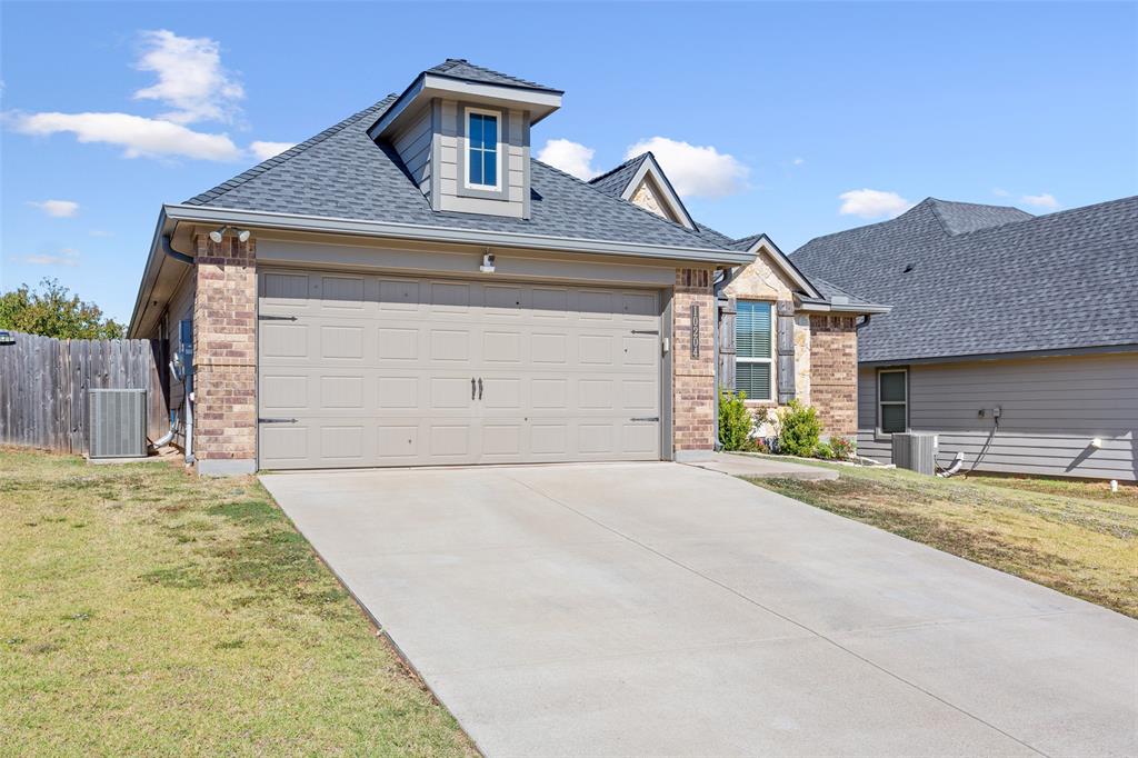 10204 Driskill Drive Waco, TX 76708 - Photo 2 of 30 a front view of a house with a yard and garage