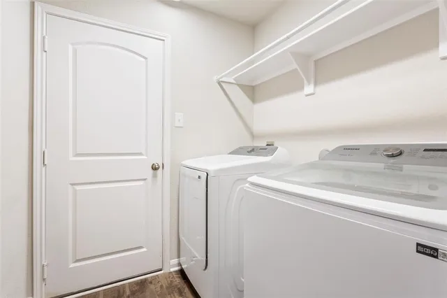 a utility room with dryer and washer