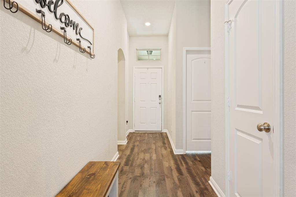 10204 Driskill Drive Waco, TX 76708 - Photo 5 of 30 a view of a hallway with wooden floor and staircase