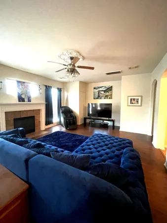 a bedroom with furniture and a fireplace