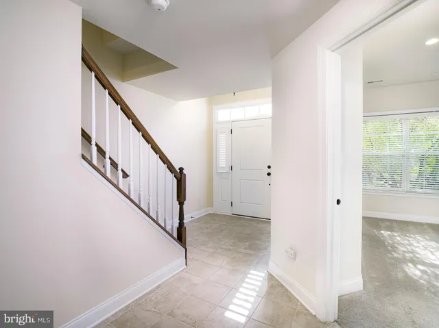 a view of an entryway with wooden floor