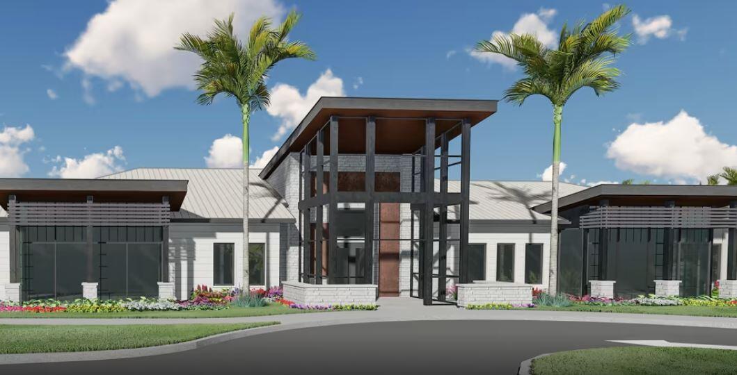 4340 Southwest Cornerstone Way, Unit WHITESTONE 136 Stuart, FL 34997 - Photo 24 of 34 a view of a building with a garden