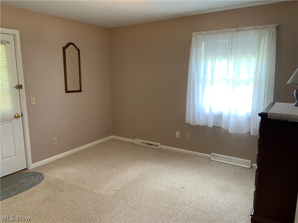 1287 Johns Road Clinton, OH 44216 - Photo 16 of 33 Bedroom has door that leads to small deck.