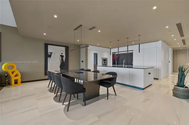 a kitchen with stainless steel appliances granite countertop a sink a oven and a counter space