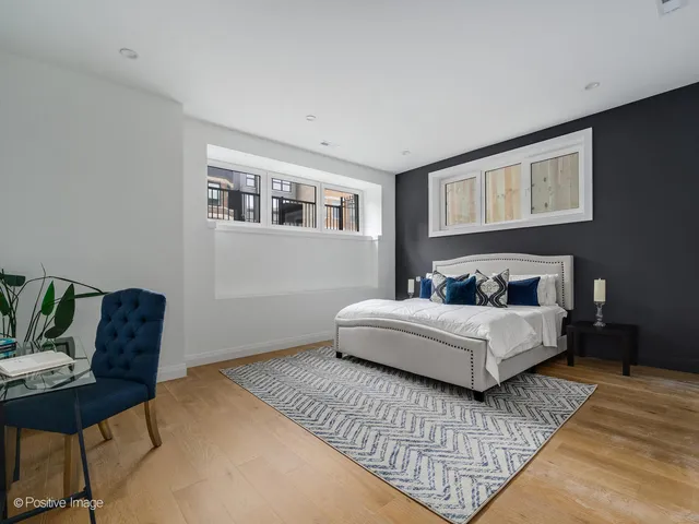 a bedroom with bed and a couch