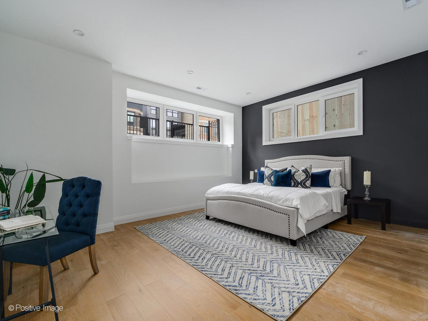 2651 West Augusta Boulevard, Unit 1 Chicago, IL 60622 - Photo 11 of 20 a bedroom with bed and a couch