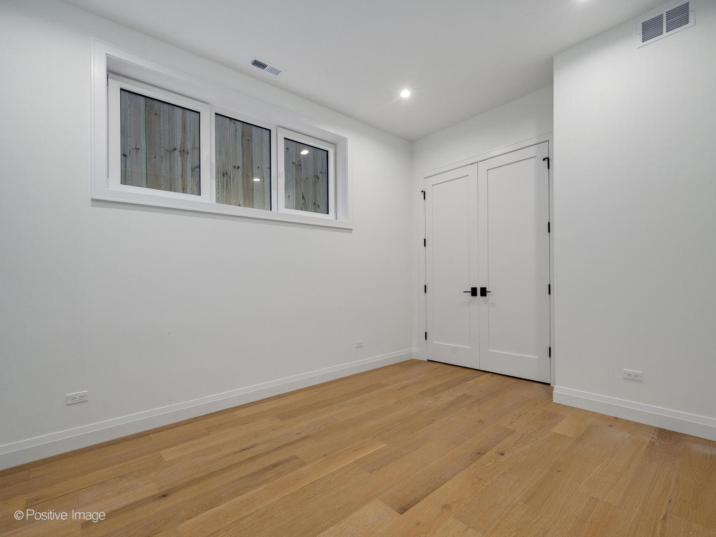 2651 West Augusta Boulevard, Unit 1 Chicago, IL 60622 - Photo 17 of 20 a view of empty room with windows