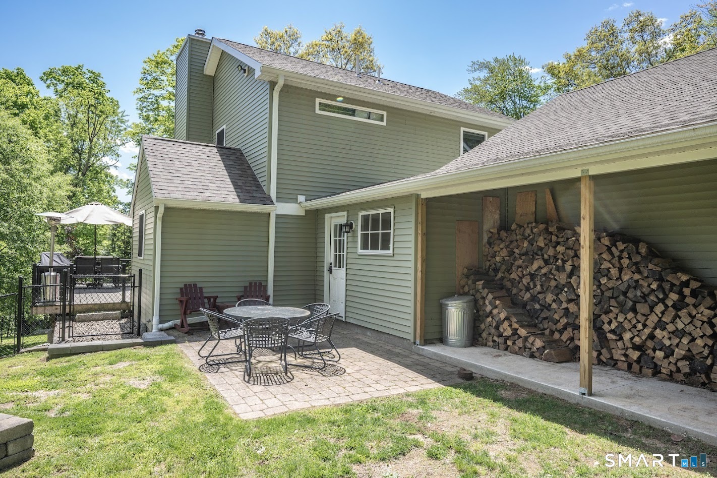 394 Brainard Hill Road Haddam, CT 06441 - Photo 20 of 23 a view of a chair and table in backyard of the house