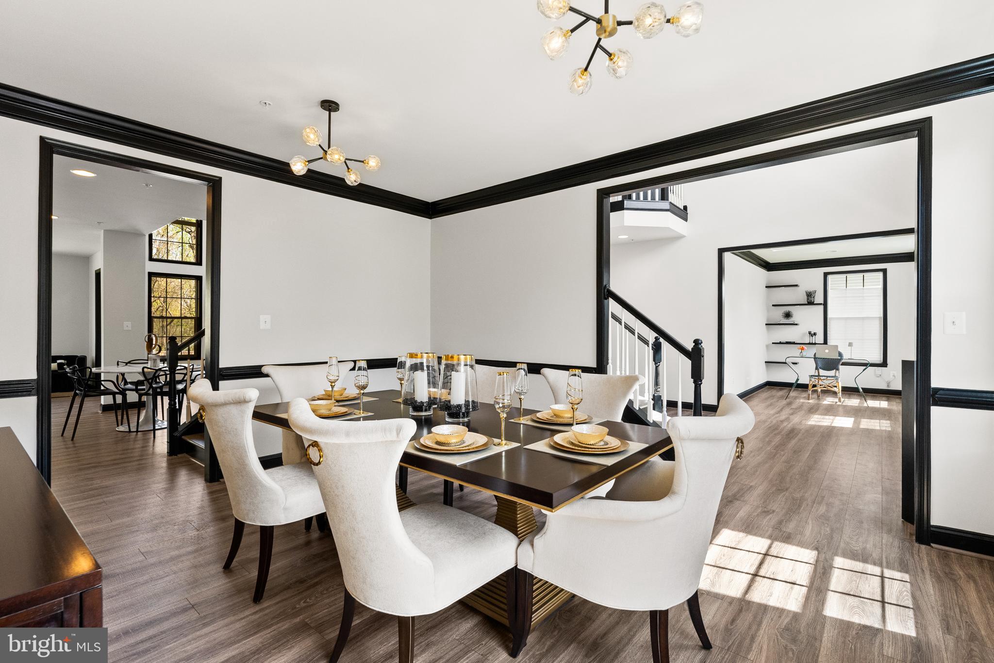 4012 Diamondhead Avenue Bowie, MD 20721 - Photo 15 of 96 a view of a a dining room and livingroom with furniture wooden floor a chandelier