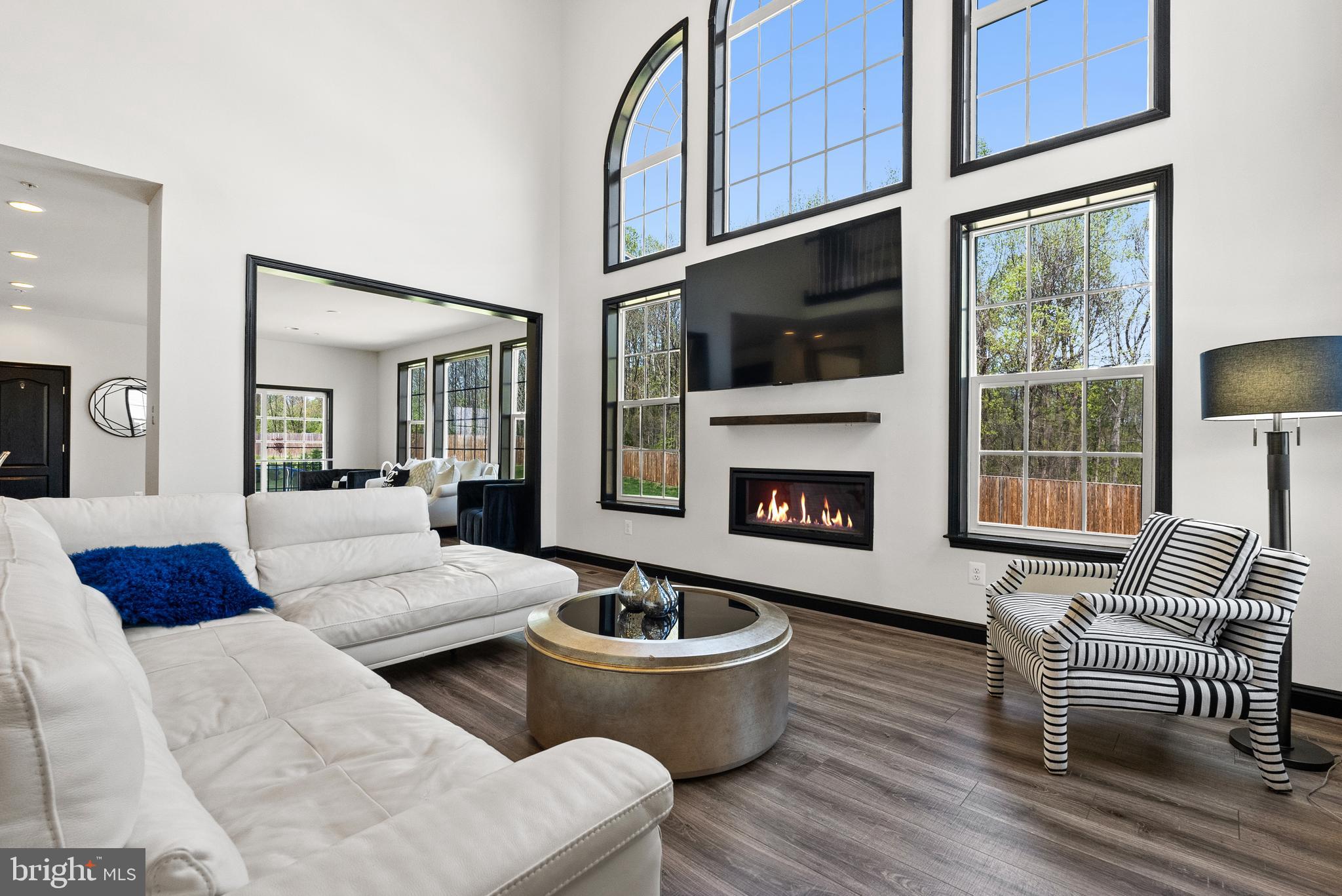 4012 Diamondhead Avenue Bowie, MD 20721 - Photo 20 of 96 a living room with furniture fireplace and flat screen tv