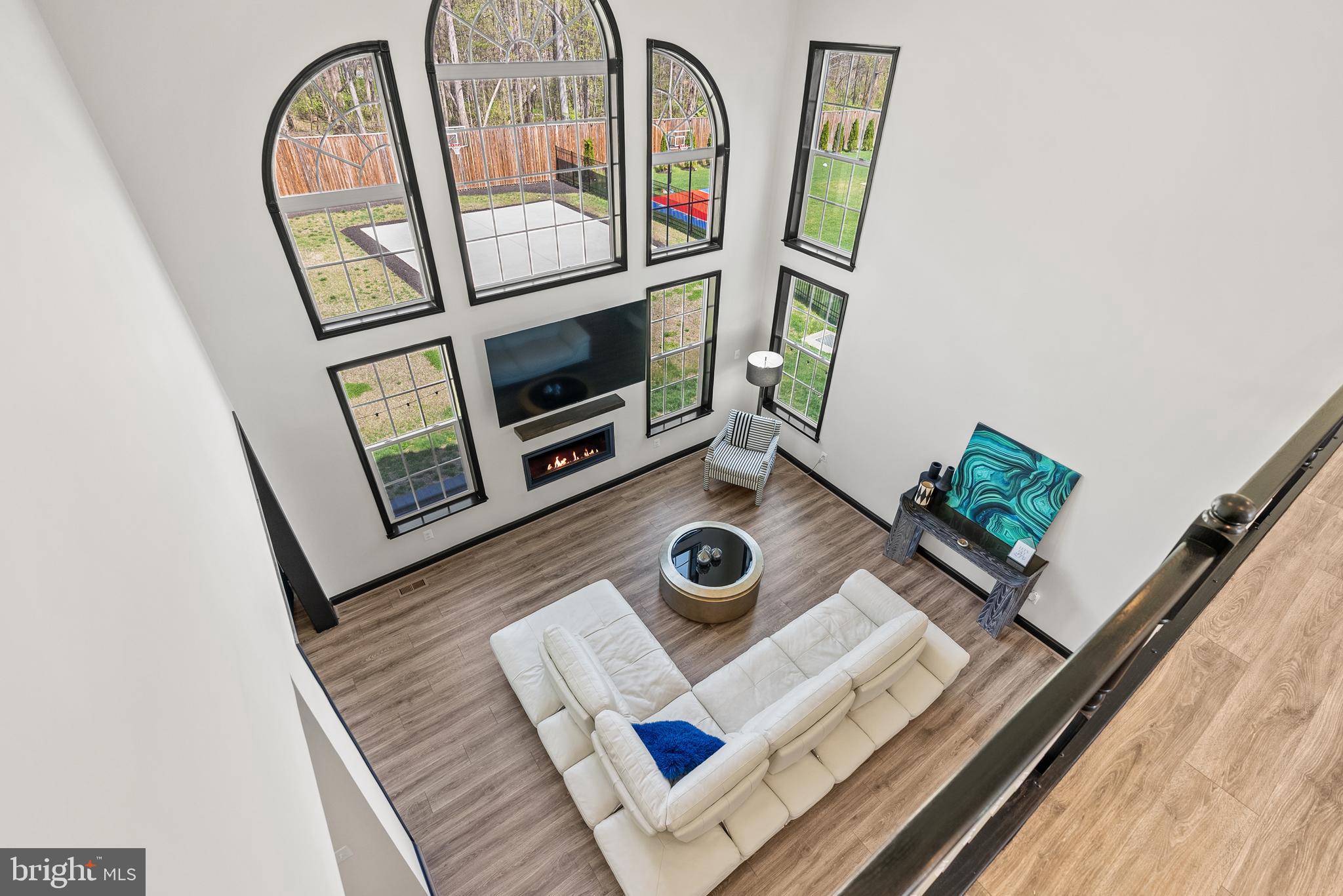 4012 Diamondhead Avenue Bowie, MD 20721 - Photo 21 of 96 a living room with furniture and a fireplace