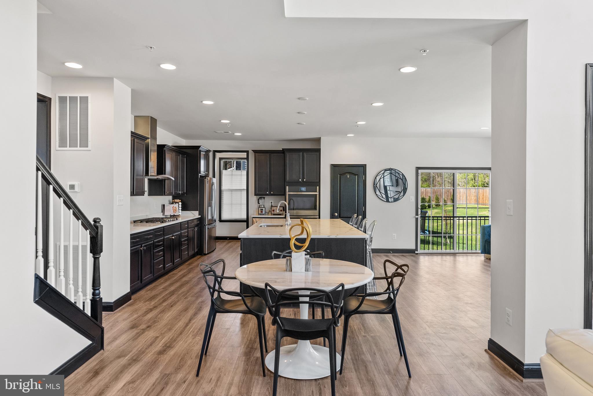 4012 Diamondhead Avenue Bowie, MD 20721 - Photo 23 of 96 a view of a dining room with furniture window and wooden floor