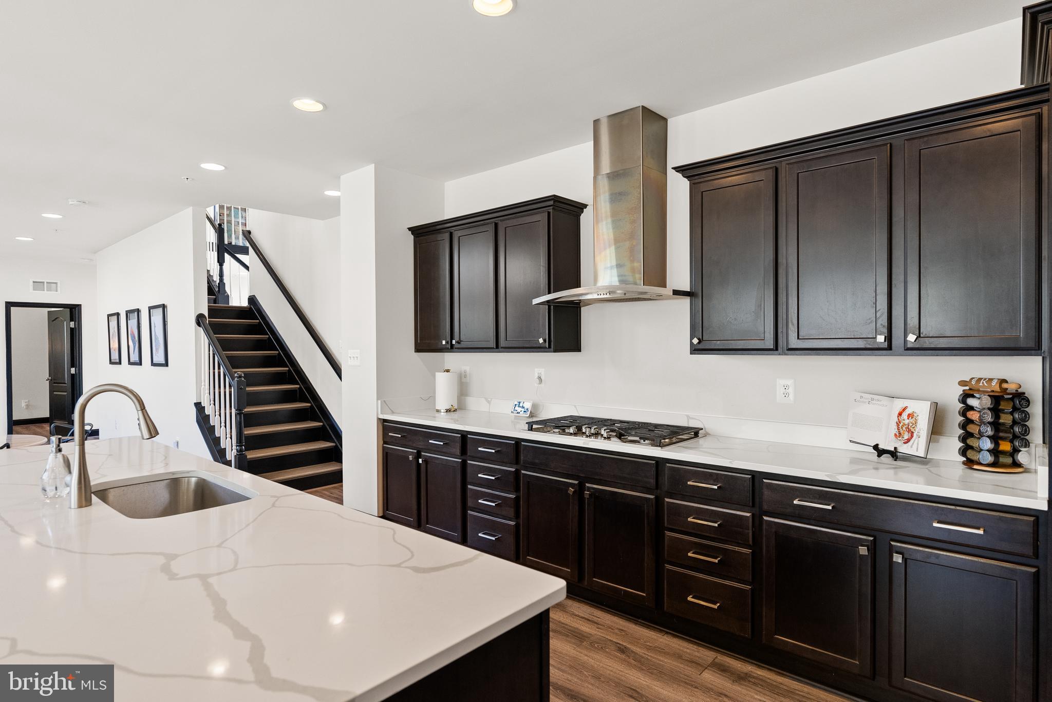 4012 Diamondhead Avenue Bowie, MD 20721 - Photo 29 of 96 a kitchen with granite countertop a sink a stove and cabinets