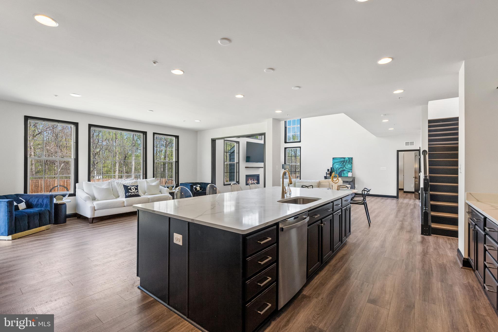 4012 Diamondhead Avenue Bowie, MD 20721 - Photo 30 of 96 a kitchen with stainless steel appliances granite countertop sink stove and wooden floor