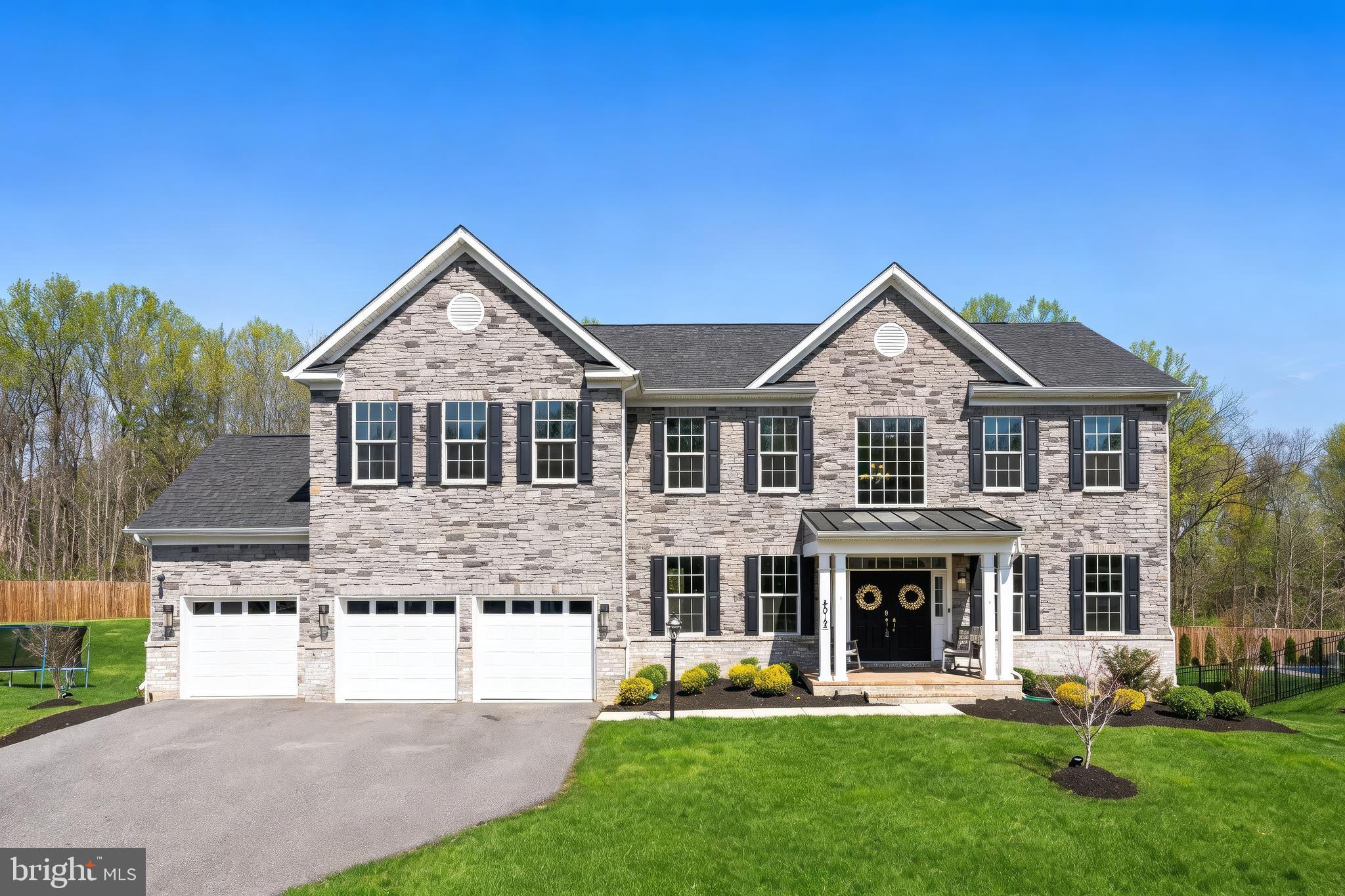 4012 Diamondhead Avenue Bowie, MD 20721 - Photo 3 of 96 a front view of a house with a yard table and chairs