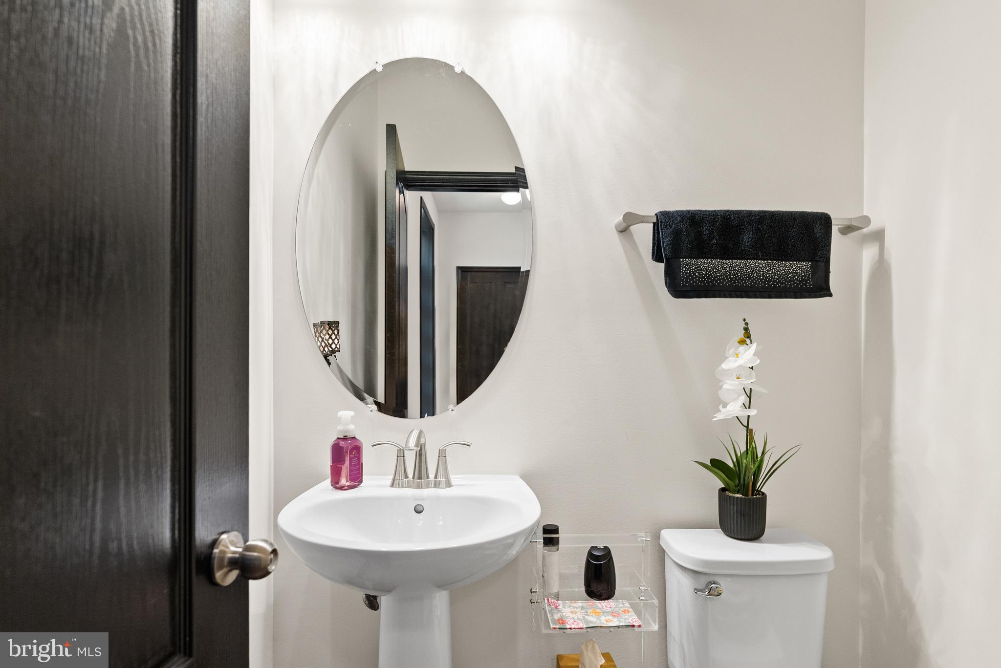 4012 Diamondhead Avenue Bowie, MD 20721 - Photo 35 of 96 a bathroom with a sink and a mirror