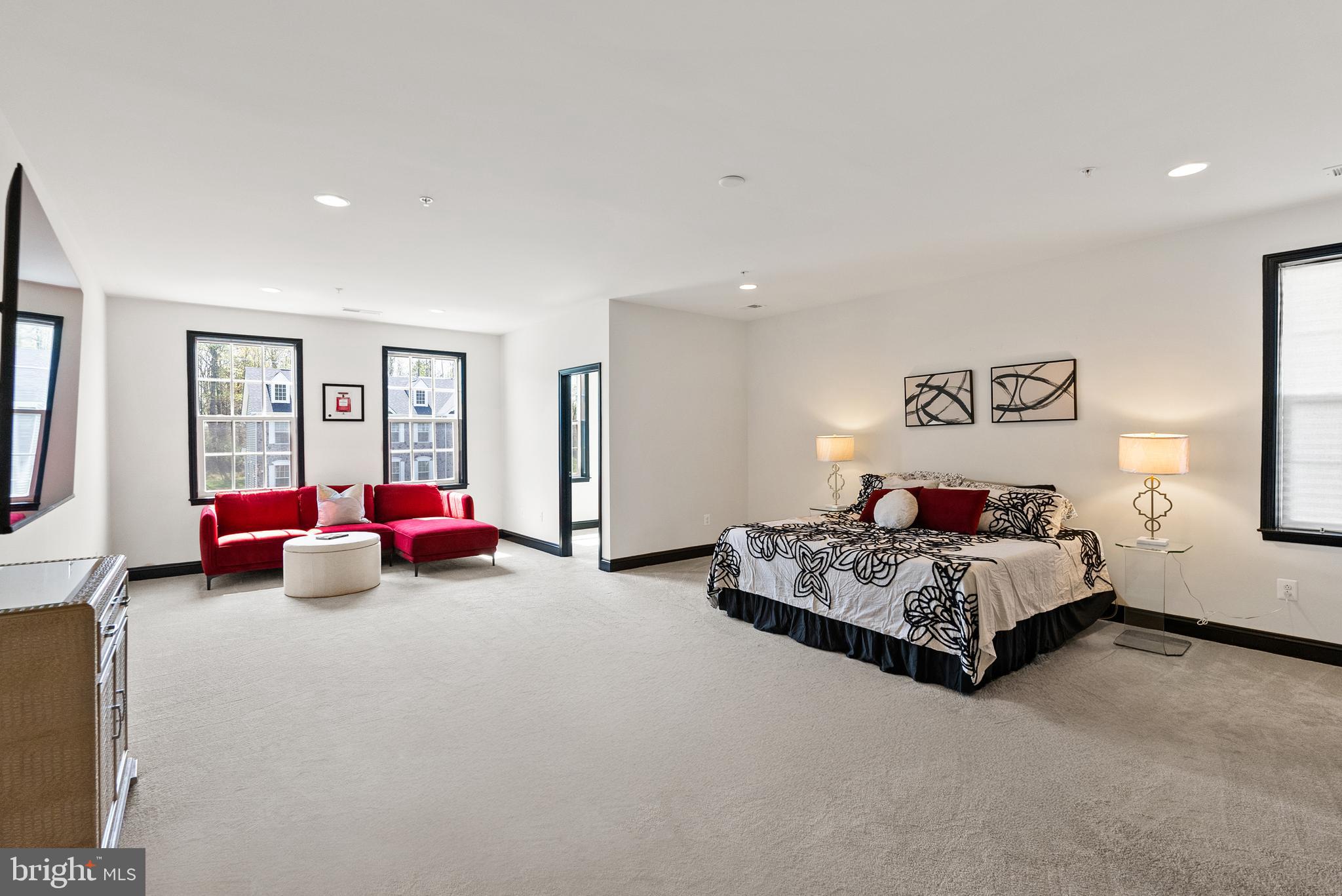 4012 Diamondhead Avenue Bowie, MD 20721 - Photo 43 of 96 a spacious bedroom with a bed and a couch