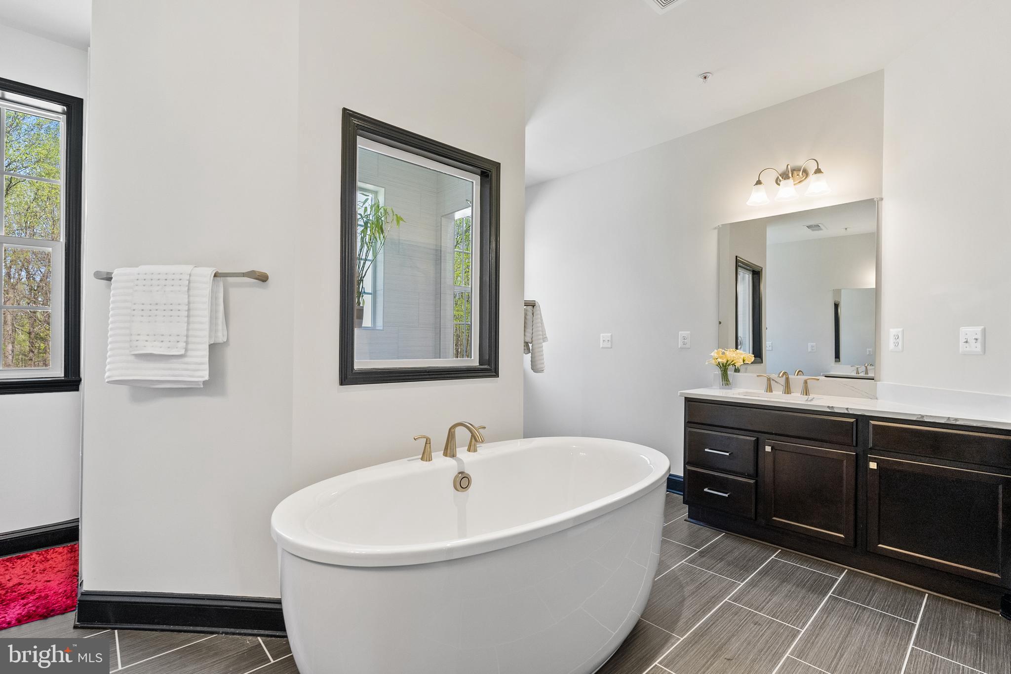 4012 Diamondhead Avenue Bowie, MD 20721 - Photo 48 of 96 a bathroom with a bathtub and a sink
