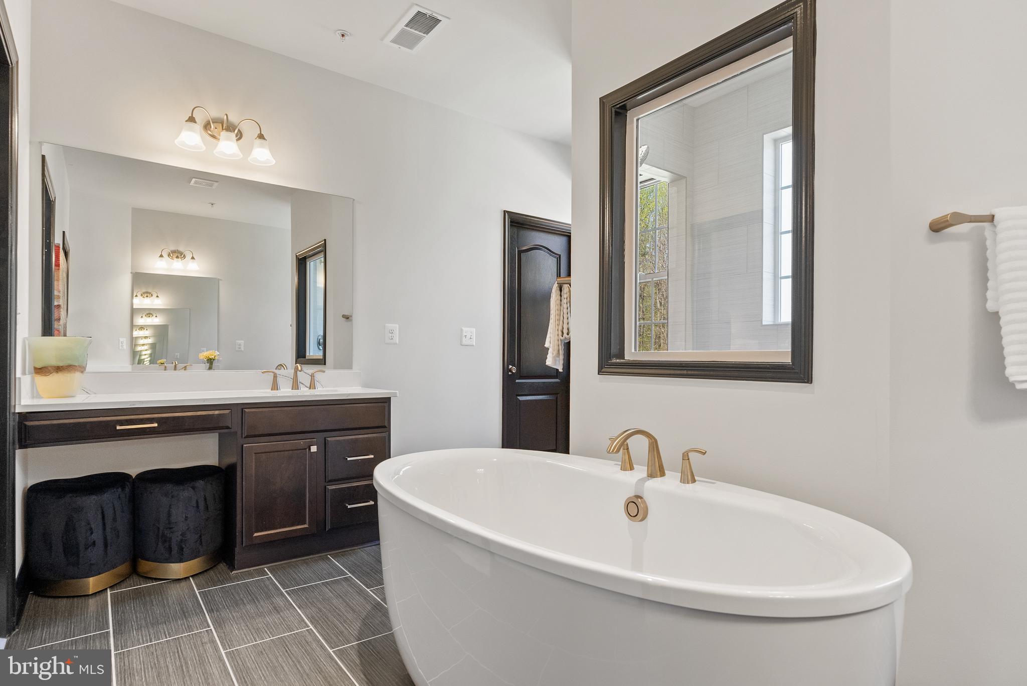 4012 Diamondhead Avenue Bowie, MD 20721 - Photo 49 of 96 a bathroom with a double vanity sink mirror and bathtub