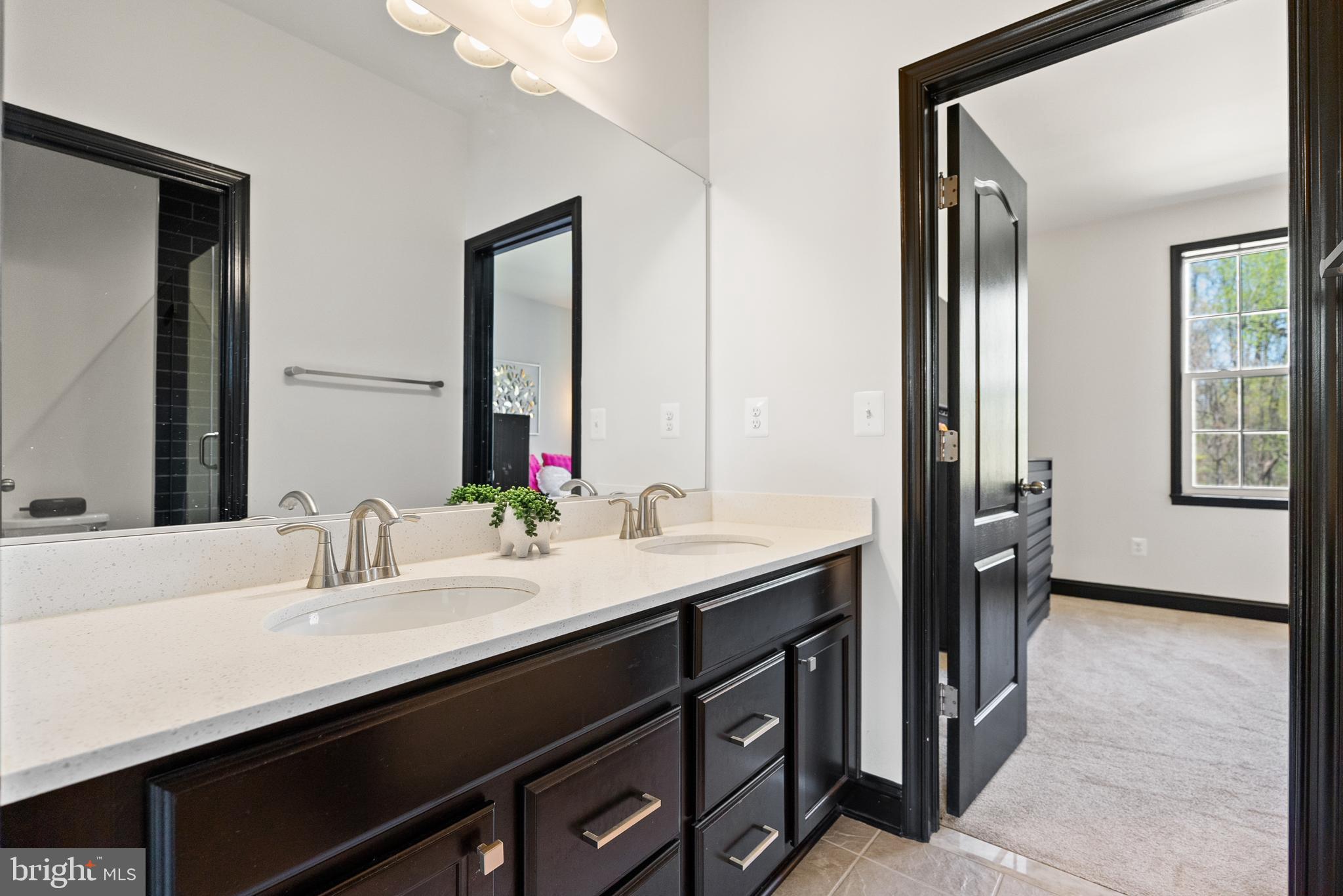 4012 Diamondhead Avenue Bowie, MD 20721 - Photo 54 of 96 a bathroom with a double vanity sink and a mirror