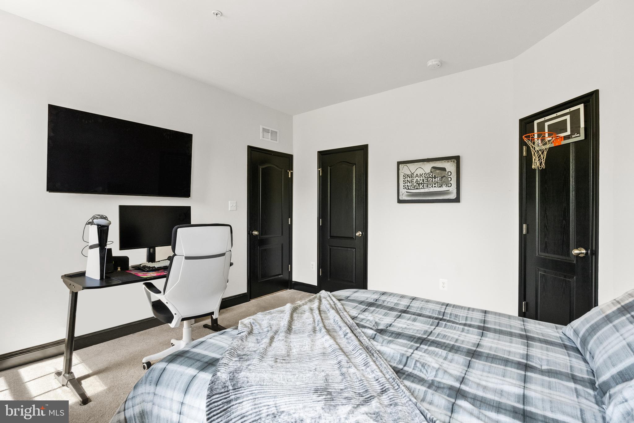 4012 Diamondhead Avenue Bowie, MD 20721 - Photo 56 of 96 a bedroom with a bed tv and chair