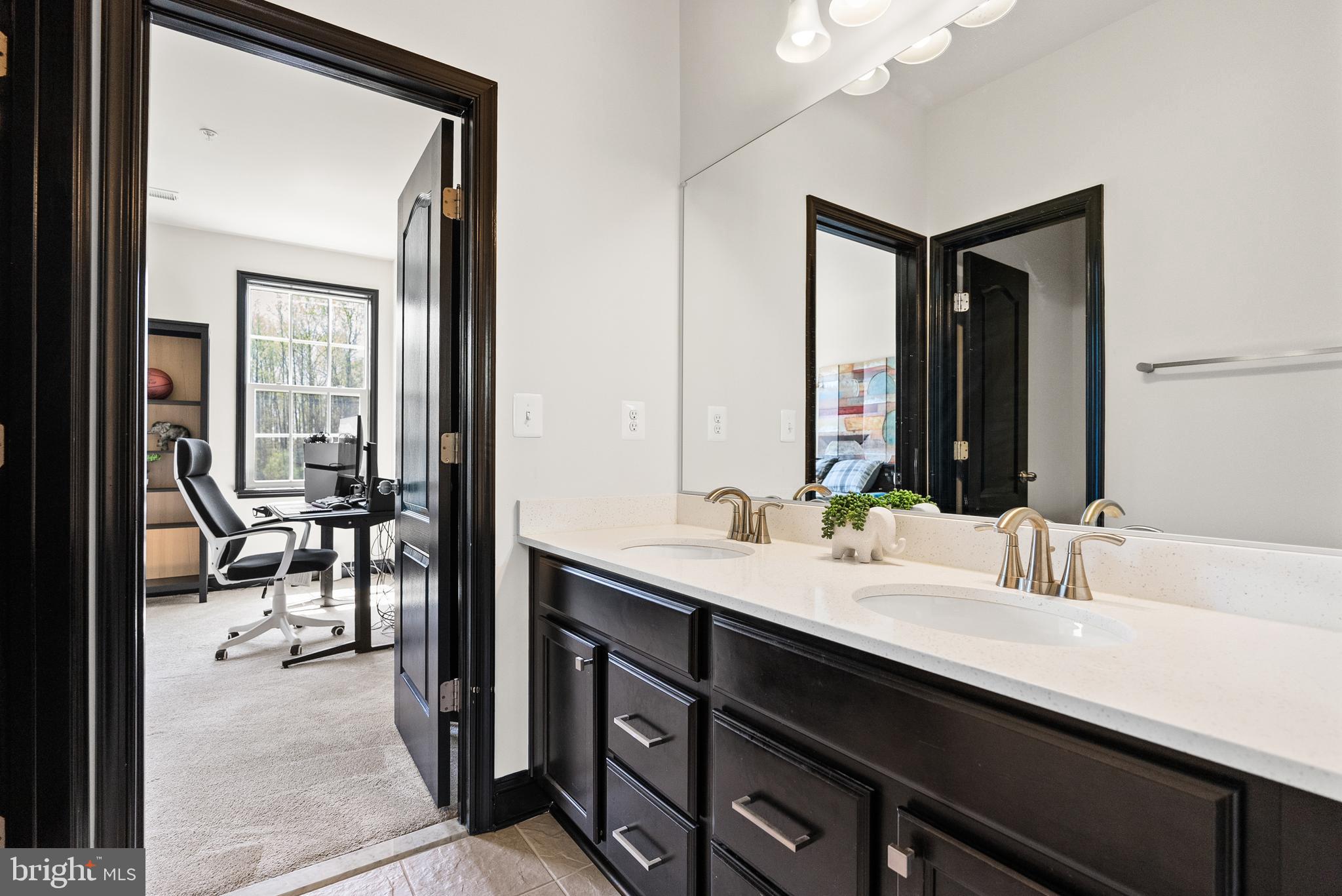 4012 Diamondhead Avenue Bowie, MD 20721 - Photo 57 of 96 a en suite bathroom with a double vanity sink and a mirror