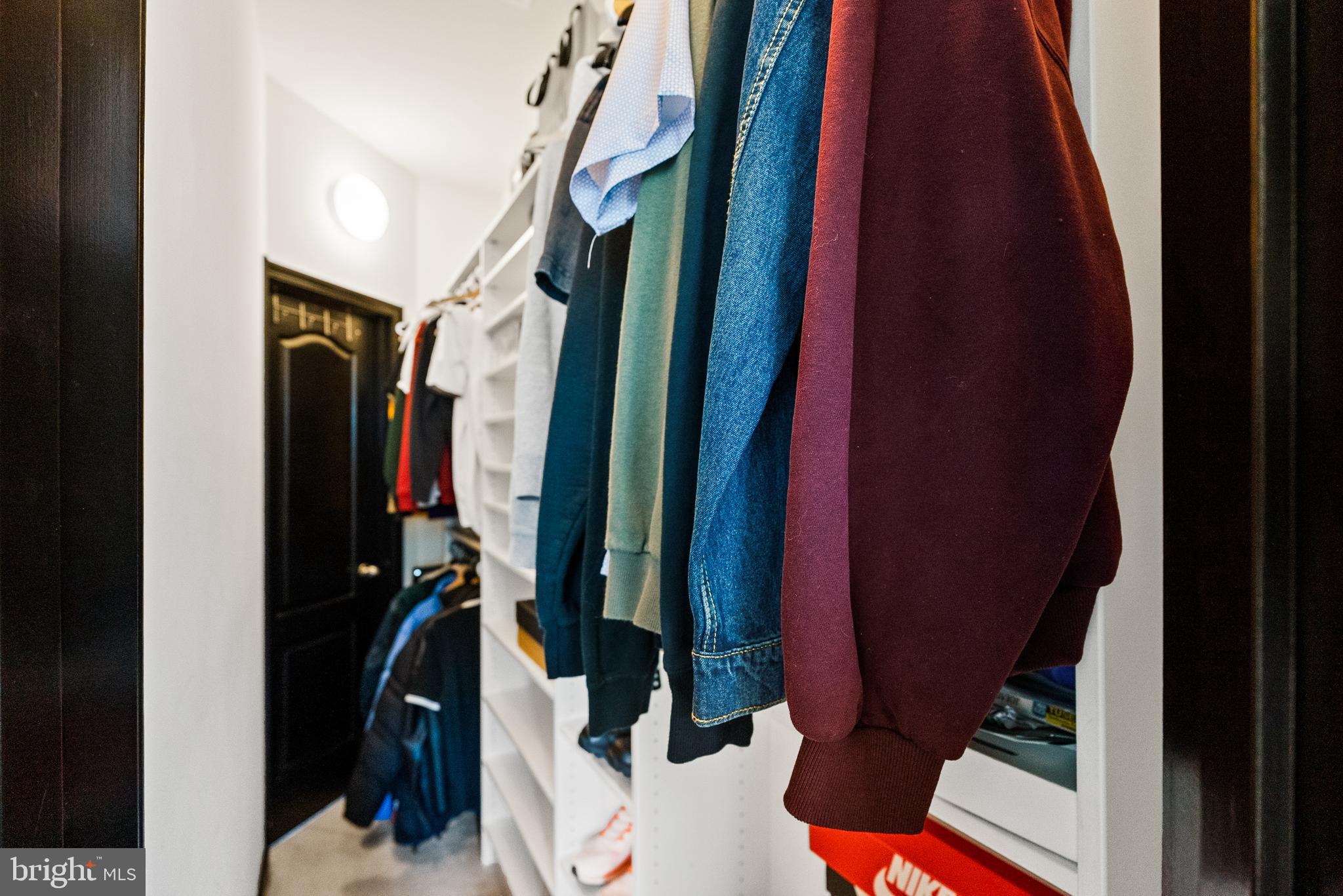 4012 Diamondhead Avenue Bowie, MD 20721 - Photo 58 of 96 a view of walk in closet with clothes and shoes