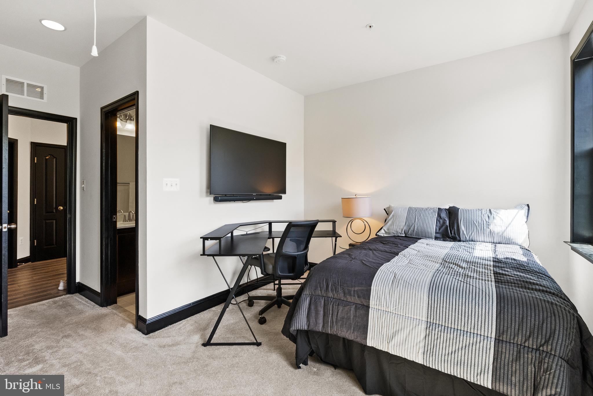 4012 Diamondhead Avenue Bowie, MD 20721 - Photo 60 of 96 a bedroom with a bed and a flat screen tv