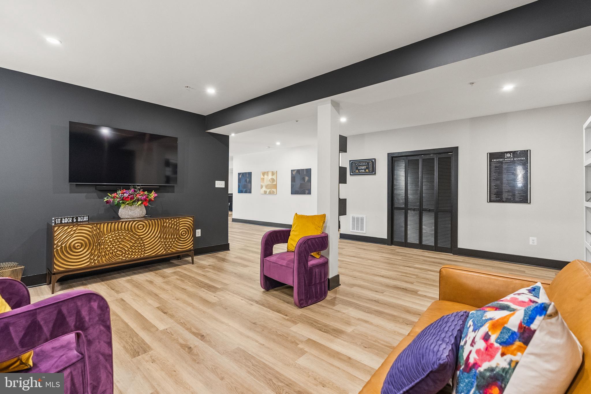 4012 Diamondhead Avenue Bowie, MD 20721 - Photo 69 of 96 a living room with furniture and a flat screen tv