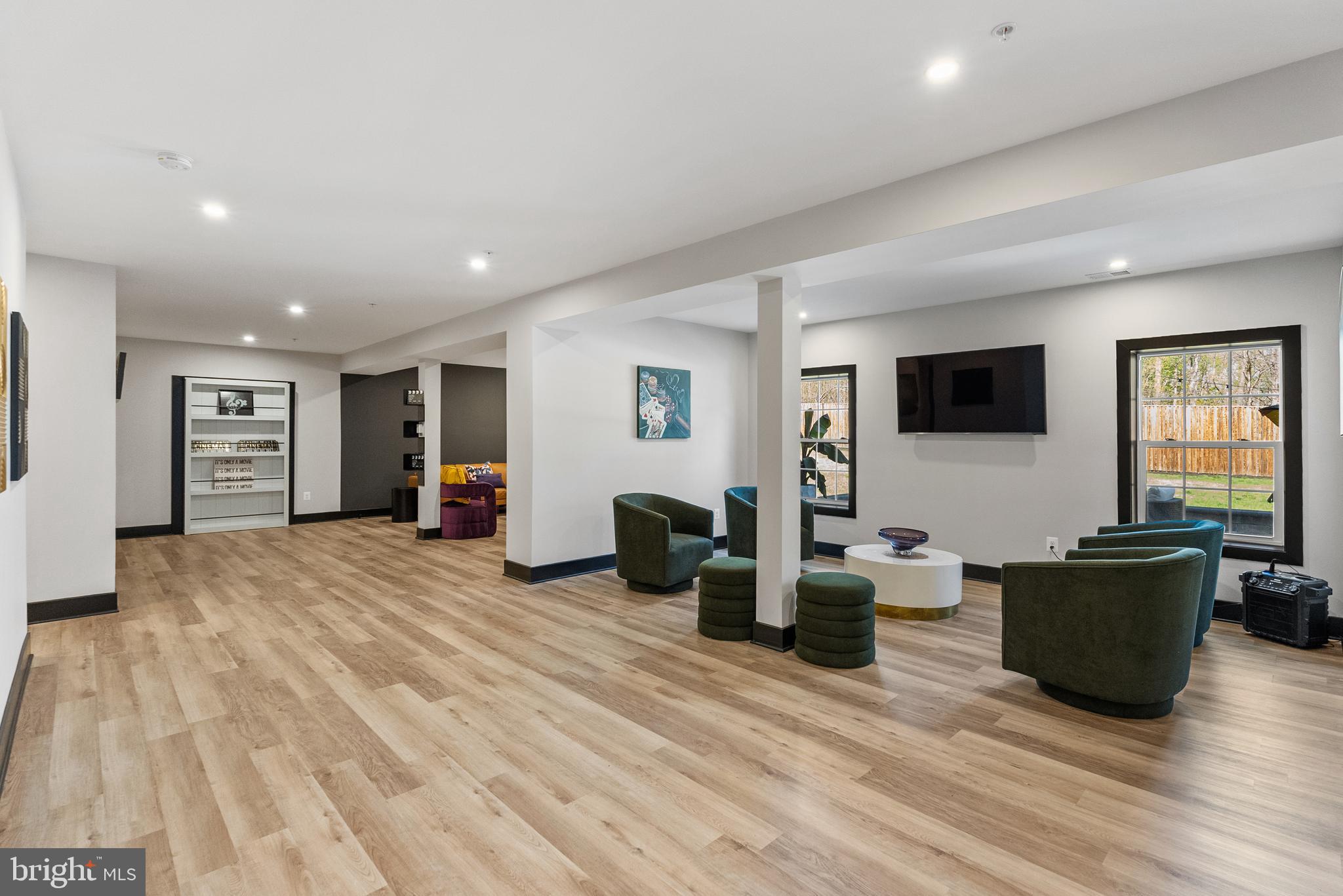 4012 Diamondhead Avenue Bowie, MD 20721 - Photo 70 of 96 a living room with furniture a flat screen tv and wooden floor