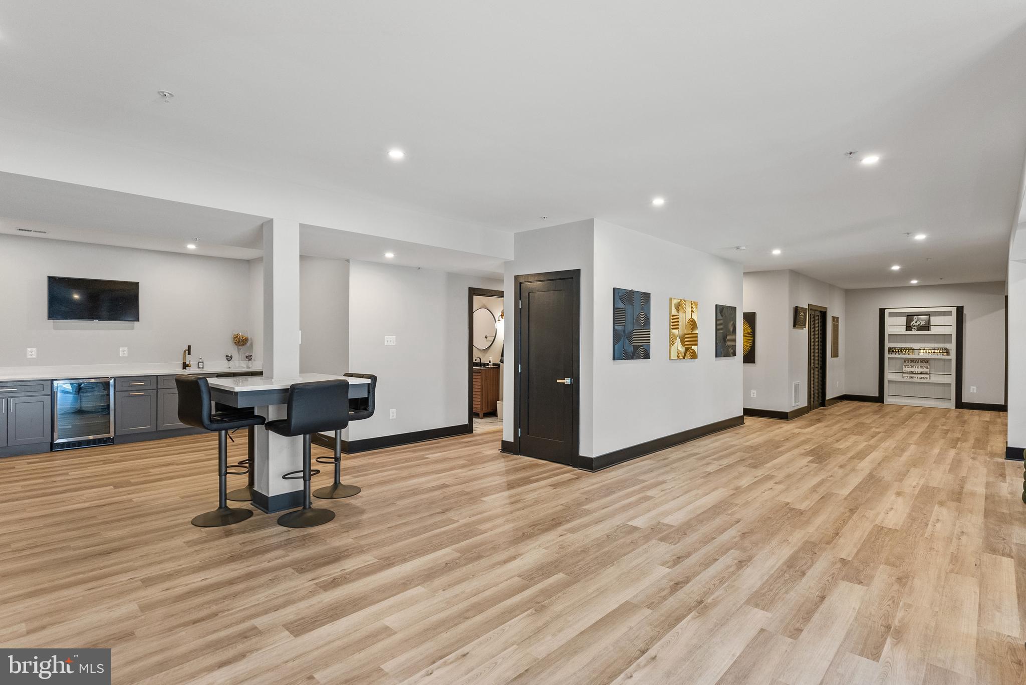 4012 Diamondhead Avenue Bowie, MD 20721 - Photo 73 of 96 a view of a living room a dining room wooden floor and a large window