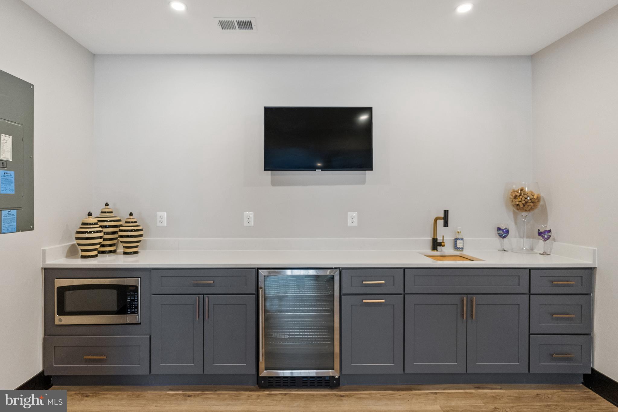 4012 Diamondhead Avenue Bowie, MD 20721 - Photo 75 of 96 a kitchen with a sink and a microwave