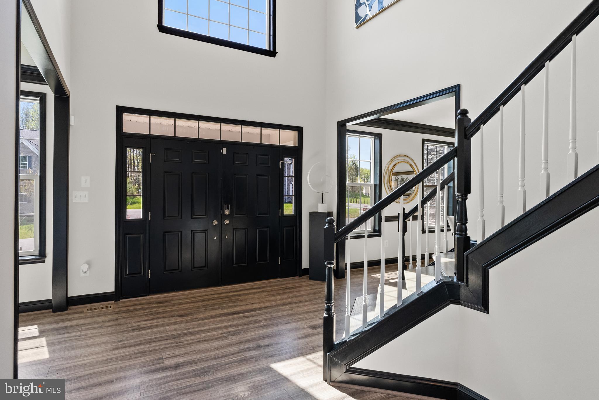 4012 Diamondhead Avenue Bowie, MD 20721 - Photo 79 of 96 a view of an entryway door with wooden floor and stairs